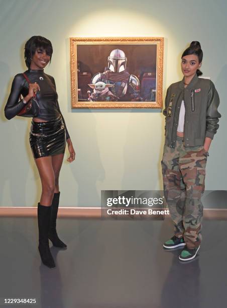 Leomie Anderson and Neelam Gill attend a private view of "The Mandalorian And The Child", a special portrait being unveiled in collaboration with the...