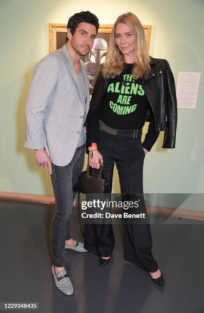 Joseph Bates and Jodie Kidd attend a private view of "The Mandalorian And The Child", a special portrait being unveiled in collaboration with the...