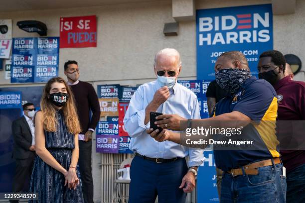 Democratic presidential nominee Joe Biden and his granddaughter Natalie Biden make a visit to a voter mobilization center on October 29, 2020 in Fort...