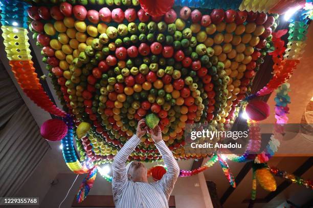 Sukkah, is made of fruits inside a Samaritan's house ahead of the Sukkot Holiday as the preparations continue amid the coronavirus pandemic, in...