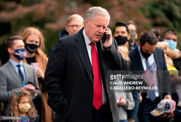 White House Chief of Staff Mark Meadows speaks on his phone as he waits for US President Donald Trump to depart the White House on October 30, 2020...