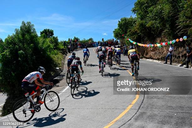 Cyclists compete during the stage 8 of the Vuelta a Guatemala cycling race in San Pablo La Laguna, 165 km west of Guatemala City, on October 30,...