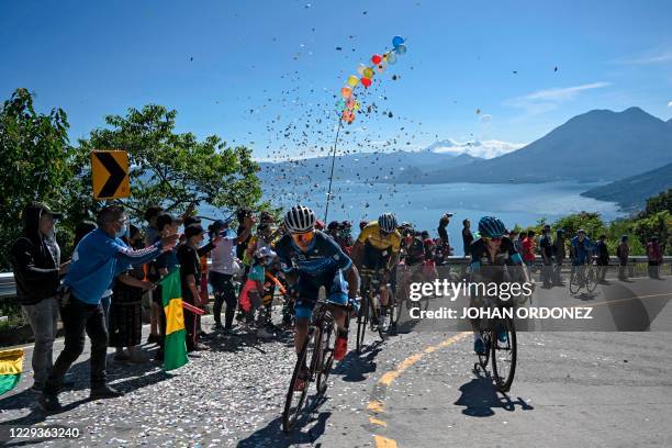 Cyclists compete during the stage 8 of the Vuelta a Guatemala cycling race in San Pablo La Laguna, 165 km west of Guatemala City, on October 30,...