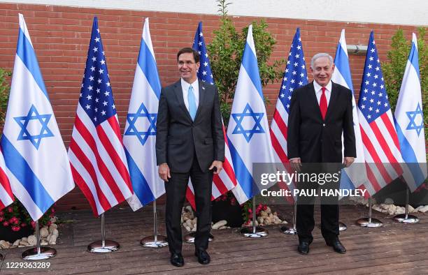 Defense Secretary Mark Esper and Israeli Prime Minister Benjamin Netanyahu pose for a picture together as they meet at the Israel Aerospace...