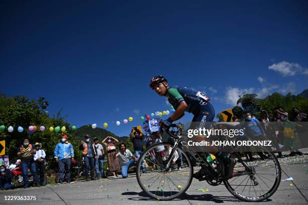 Cyclist competes during the stage 8 of the Vuelta a Guatemala cycling race in San Pablo La Laguna, 165 km west of Guatemala City, on October 30,...