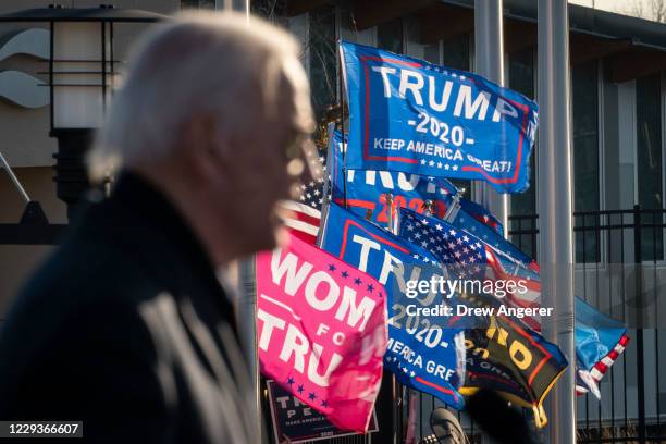 Supporters of President Donald Trump rally outside the gates of the venue as Democratic presidential nominee Joe Biden speaks during a drive-in...