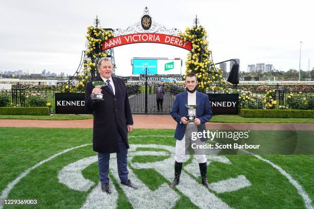 Trainer of Johnny Get Angry , Denis Pagan and Lachlan King pose with the trophy after winning the AAMI Victoria Derby at Flemington Racecourse on...