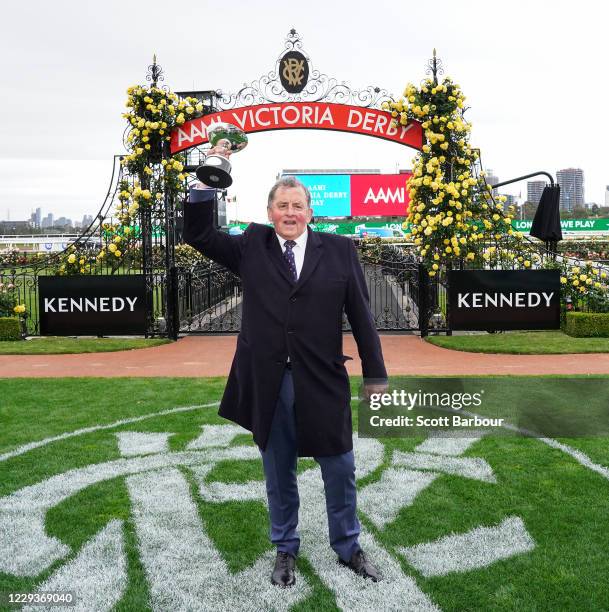 Trainer of Johnny Get Angry , Denis Pagan with the trophy after winning the AAMI Victoria Derby at Flemington Racecourse on October 31, 2020 in...