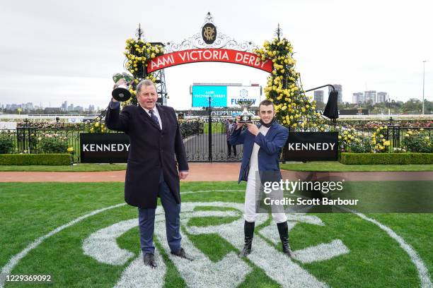 Trainer of Johnny Get Angry , Denis Pagan and Lachlan King pose with the trophy after winning the AAMI Victoria Derby at Flemington Racecourse on...