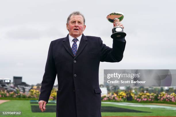 Trainer of Johnny Get Angry , Denis Pagan with the trophy after winning the AAMI Victoria Derby at Flemington Racecourse on October 31, 2020 in...