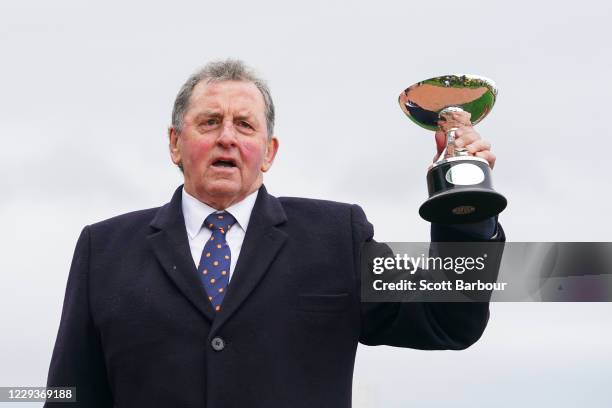 Trainer of Johnny Get Angry , Denis Pagan with the trophy after winning the AAMI Victoria Derby at Flemington Racecourse on October 31, 2020 in...