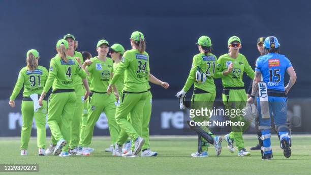 Sydney Thunder team celebrates victory against Adelaide Strikers during the Women's Big Bash League WBBL match between the Sydney Thunder and the...
