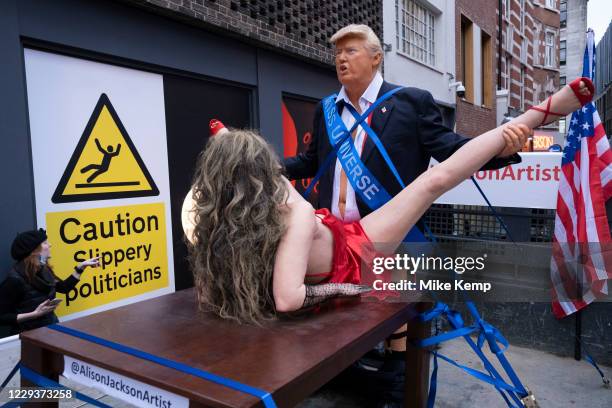 Image contains graphic material) Explicit art installation Donald Trump and Miss Universe by English artist Alison Jackson on the back of a truck in...