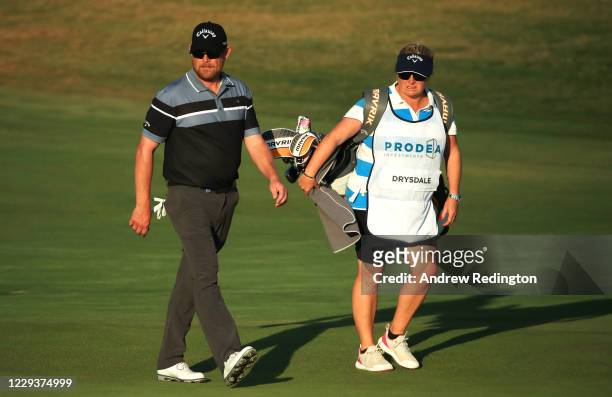 David Drysdale of Scotland walks with caddie and wife Vikki on the 18th hole during the third round of the Aphrodite Hills Cyprus Open at Aphrodite...
