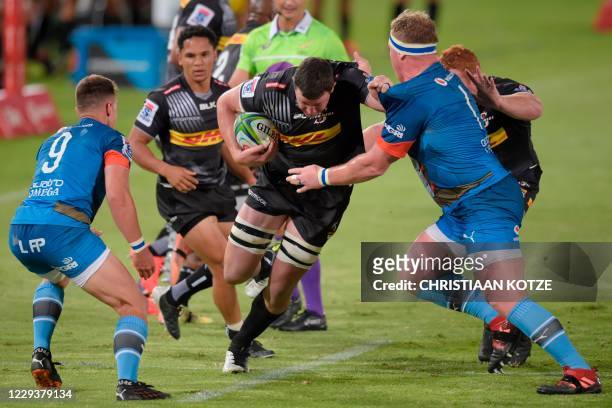 Stormers' JD Schickerling is tackled by Bulls' Jacques Van Rooyen during the fourth round match in the South African Super Rugby Unlocked competition...