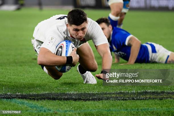 England's scrum-half Ben Youngs dives across the line to score a try during the Six Nations rugby union tournament match between Italy and England at...