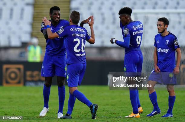 Bruno Ramires of Belenenses SAD celebrates with teammate Henrique Buss of Belenenses SAD after scoring a goal during the Liga NOS match between...