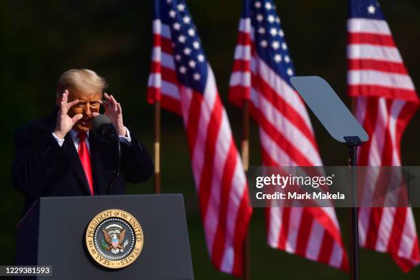 President Donald Trump mocks Democratic presidential nominee Joe Biden's eyesight while addressing supporters during a rally on October 31, 2020 in...