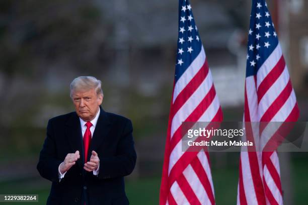 President Donald Trump acknowledges supporters after holding a campaign rally on October 31, 2020 in Newtown, Pennsylvania. With the election only...