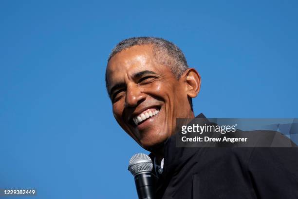 Former U.S. President Barack Obama speaks during a drive-in campaign rally for Democratic presidential nominee Joe Biden at Northwestern High School...