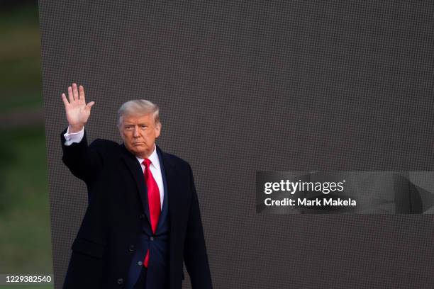 President Donald Trump acknowledges supporters after holding a campaign rally on October 31, 2020 in Newtown, Pennsylvania. With the election only...