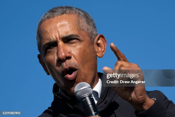 Former U.S. President Barack Obama speaks during a drive-in campaign rally for Democratic presidential nominee Joe Biden at Northwestern High School...
