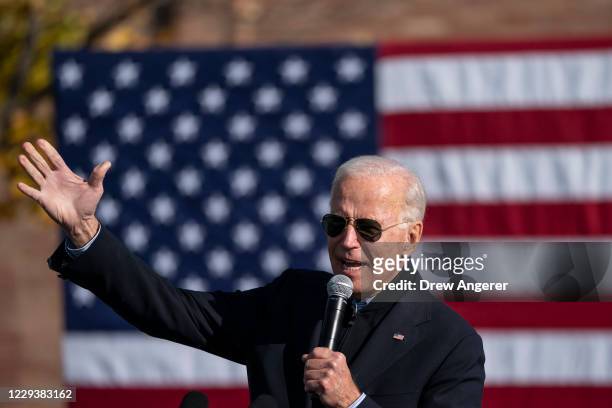 Democratic presidential nominee Joe Biden speaks during a drive-in campaign rally at Northwestern High School on October 31, 2020 in Flint, Michigan....