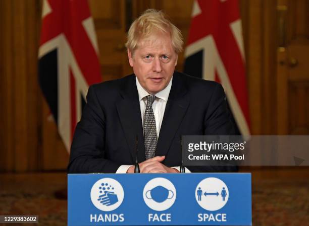 Britain's Prime Minister Boris Johnson speaks during a press conference in 10 Downing Street on October 31, 2020 in London, England. The PM announced...