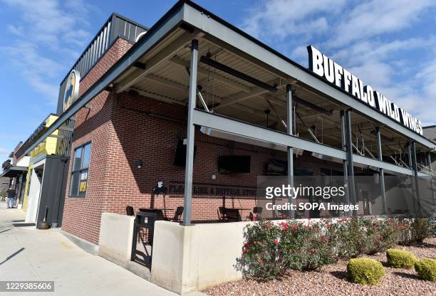 Buffalo wild wings store in Kingston. Dunkin Donuts / Baskin Robbins has been bought by Inspire brands which own Buffalo Wild Wings and Arby's.