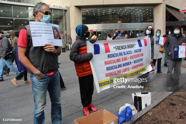 People stage a protest against the republication of offensive caricatures of the Prophet Muhammad in France and French President Emmanuel Macron's...