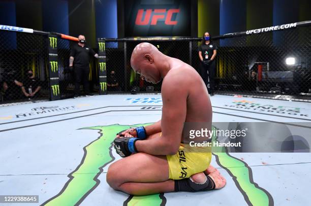 In this handout image provided by UFC, Anderson Silva of Brazil reacts after his loss to Uriah Hall in a middleweight bout during the UFC Fight Night...
