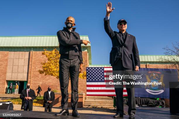 Former Vice President and presidential nominee Joe Biden and President Barrack Obama on stage during a mobilization event at Northwestern High School...