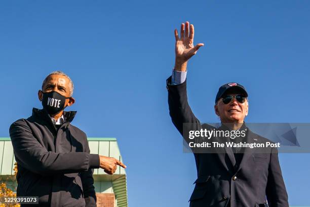 Former Vice President and presidential nominee Joe Biden and President Barrack Obama on stage during a mobilization event at Northwestern High School...