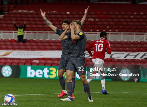 Nottingham Forest's Tobias Figueiredo and Ryan Yates react to conceding a late goal during the Sky Bet Championship match between Middlesbrough and...