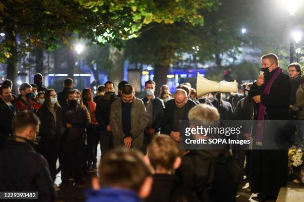 Group of counter-protesters seen praying with a priest during a counter manifestation. The Polish Constitutional Court in its new, politically chosen...