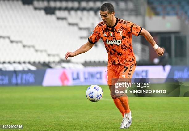 Juventus' Portuguese forward Cristiano Ronaldo controls the ball during the Italian Serie A football match between Spezia and Juventus at the Dino...