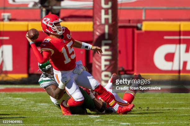 Kansas City Chiefs quarterback Patrick Mahomes throws as he is being sacked during the first half against the New York Jets on November 1, 2020 at...