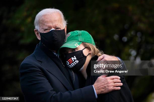 Democratic presidential nominee Joe Biden hugs his granddaughter Finnegan Biden during a canvassing kick-off event on November 01, 2020 in...