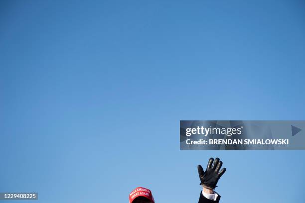 President Donald Trump leaves after speaking during a Make America Great Again rally at Dubuque Regional Airport on November 1 in Dubuque, Iowa. -...