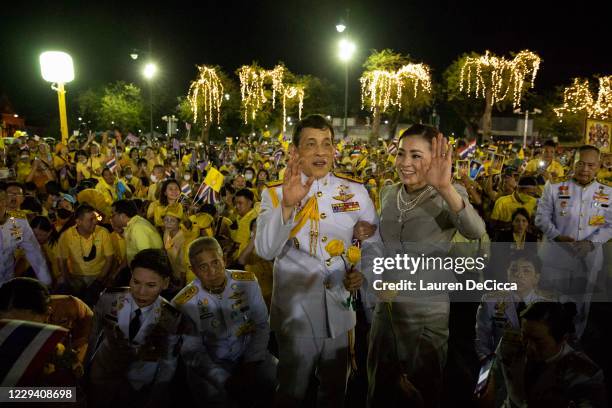 King Maha Vajiralongkorn and Queen Suthida greet supporters of the Thai monarchy outside the Grand Royal Palace on November 1, 2020 in Bangkok,...