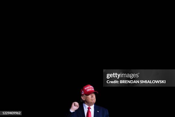 President Donald Trump walks to a Make America Great again rally at Miami-Opa Locka Executive Airport in Opa Locka, Florida on November 2, 2020.