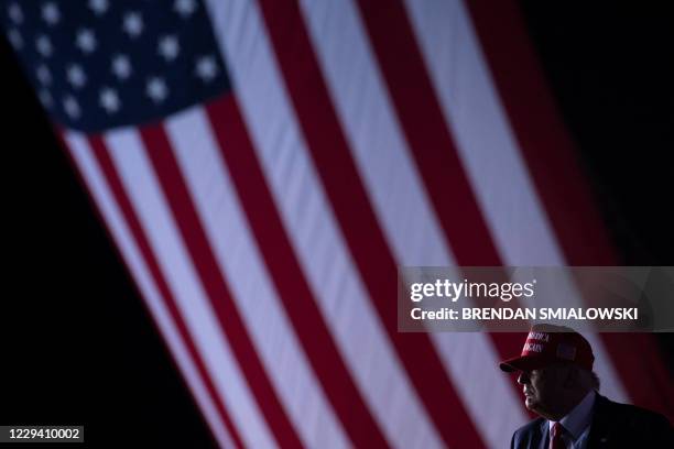 President Donald Trump leaves after speaking during a Make America Great Again rally at Miami-Opa Locka Executive Airport in Opa Locka, Florida on...