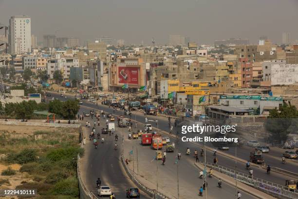 Vehicles travel along a road in the Clifton area of Karachi, Pakistan, on Friday, Oct. 16, 2020. Karachi ranks as having the worst public transport...