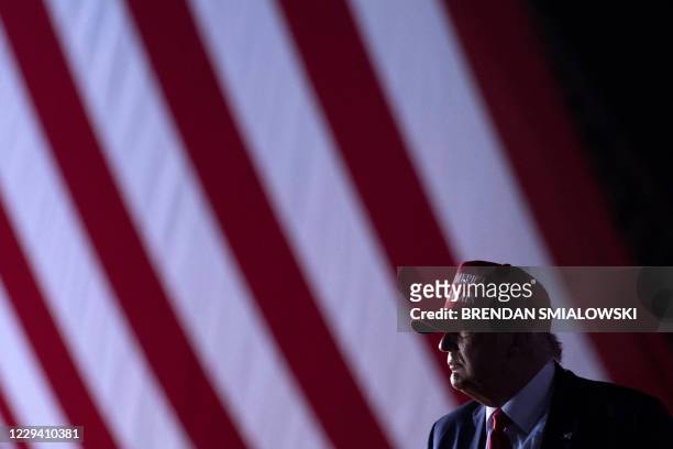 President Donald Trump leaves after speaking during a Make America Great Again rally at Miami-Opa Locka Executive Airport in Opa Locka, Florida on...