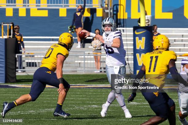 Kansas State Wildcats quarterback Will Howard attempts to pass as West Virginia Mountaineers linebacker Dylan Tonkery applies pressure during the...
