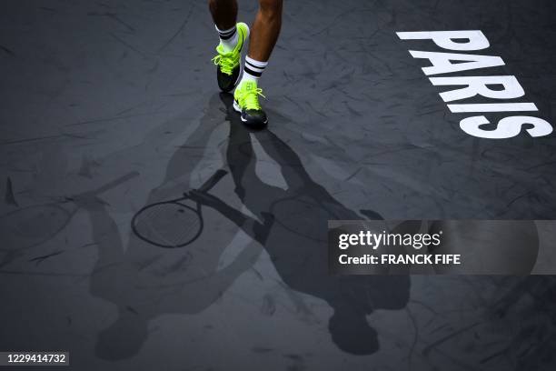 Hungary's Marton Fucsovics reacts as he plays against Croatia's Borna Coric during their men's singles first round tennis match on day 1 at the ATP...