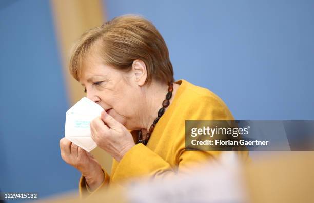 German Chancellor Angela Merkel speaks to the media following a meeting of the German government coronavirus cabinet task force during the second...