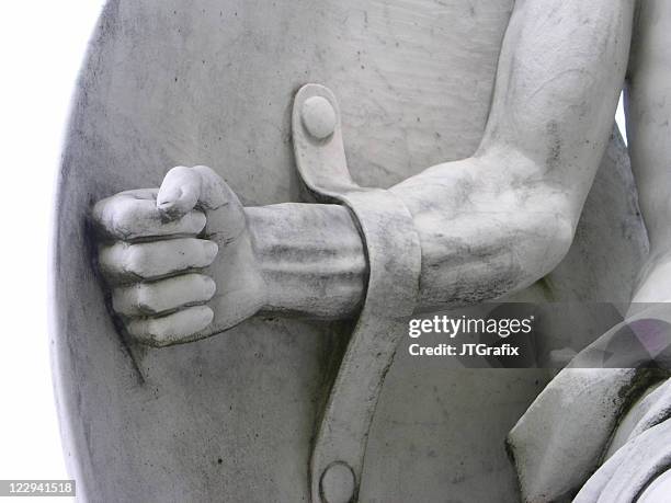 warrior strong arm and shield statue detail - fältslag bildbanksfoton och bilder