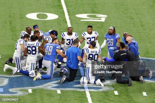Group of players from the Detroit Lions and the Indianapolis Colts including Indianapolis Colts tight end Trey Burton , Detroit Lions long snapper...
