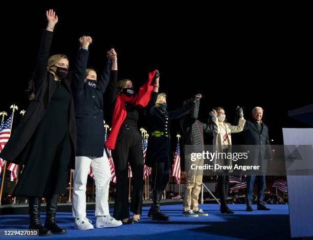 Democratic presidential nominee Joe Biden, Dr. Jill Biden and their grandchildren take the stage at the end of a drive-in campaign rally at Heinz...